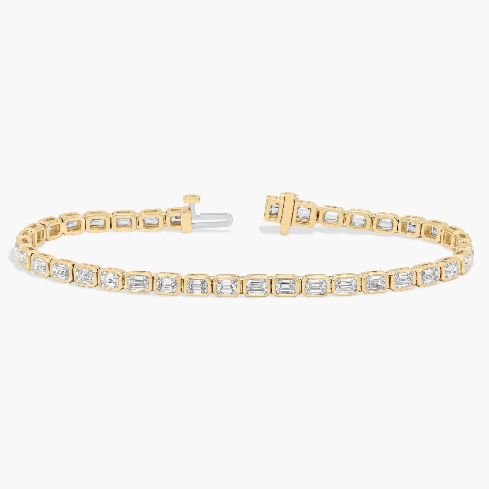 7 " Emerald Cut Lab Grown Diamond E/W Bezel Set Tennis Bracelet In 14K Yellow Gold (5 Ct. tw. - F-G / VS2-SI1)